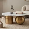 Tavolino rotondo arredamento centro estetico da Salotto Kumaro Japandi con Top in Ceramica Effetto Marmo Calacatta e Struttura Oro
